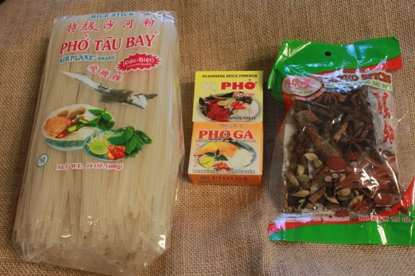 Vietnamese pho packaged ingredients set on top of a burlap textured surface