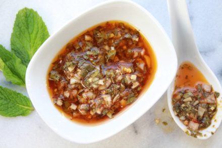 Nuoc Cham Dipping Sauce in a bowl with a white spoon