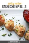 spicy baked shrimp balls on a plate being dipped in a sweet chili sauce