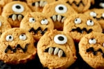 pumpkin monster cookies on a black background