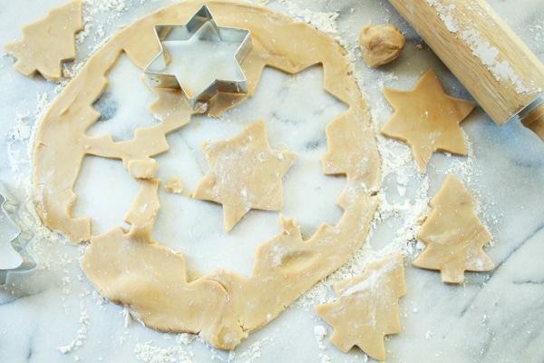 sugar cookie holiday cutouts on a pastry board