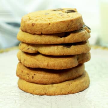 a stack of miso chocolate chip cookies on a white plate