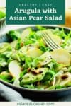 a vibrant Asian Pear salad in a bowl with a fork