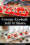 creepy lychee eyeballs on top of red jello and in small white tasting spoons