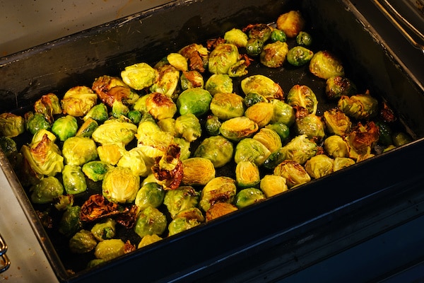 Roasted Brussels sprouts on a tray in the oven