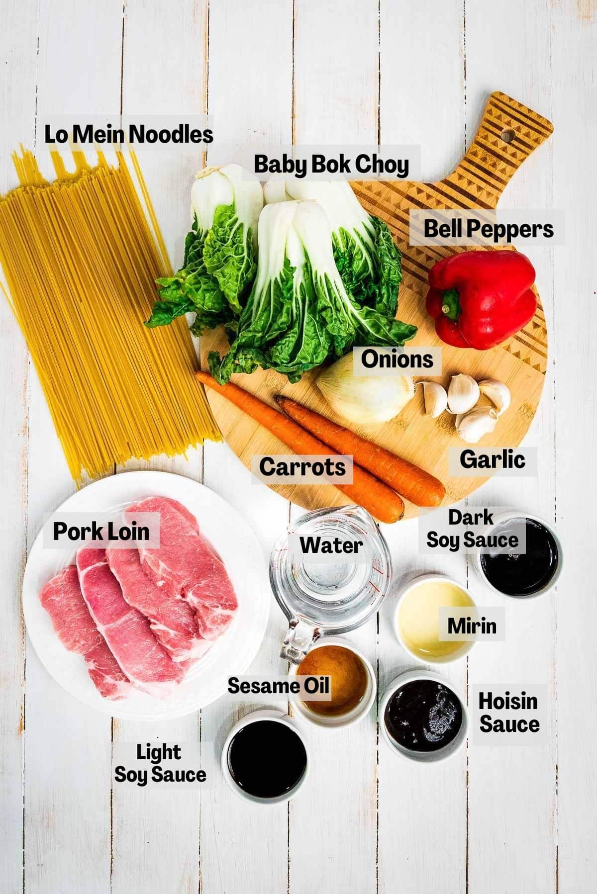 Labeled ingredients for making Instant Pot pork lo mein on top of a white board.