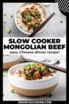 Slow Cooker Mongolian Beef in two bowls with chopsticks on top.