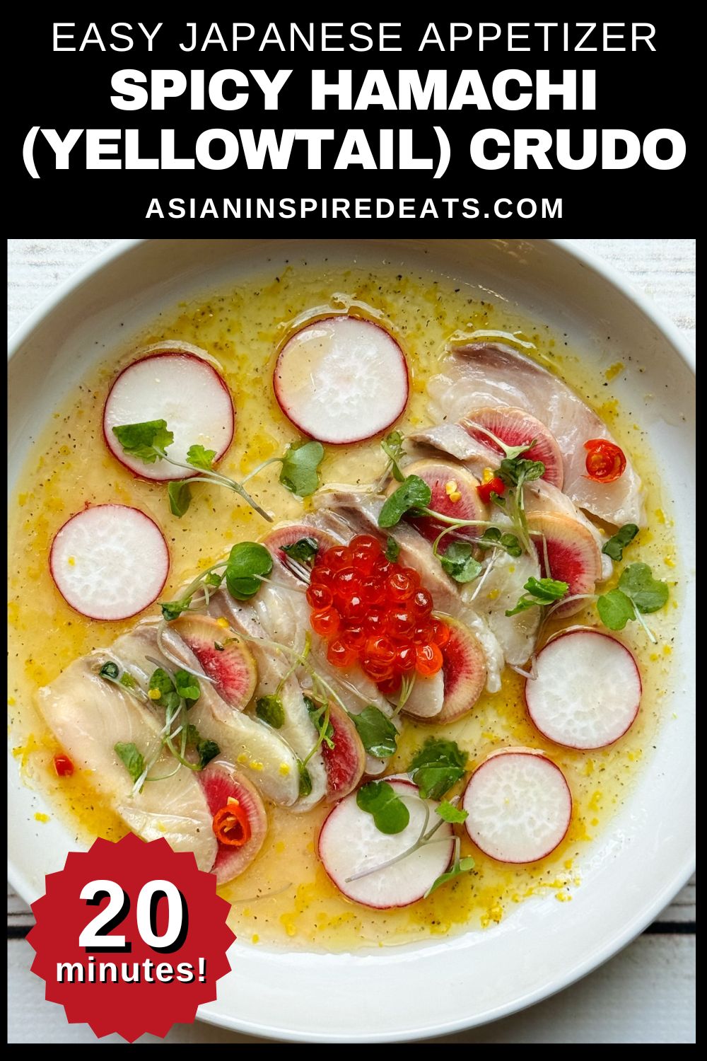 Hamachi yellowtail crudo on a white round plate with a yuzu lemon dressing surrounded by shaved radishes and topped with red fish eggs and microgreens.