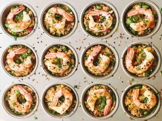 Shrimp fried rice cups baked in a muffin tin.